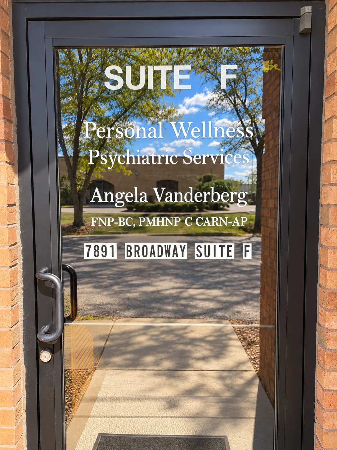 The Suite F entrance at 7891 Broadway in Merrillville, with Personal Wellness Psychiatric Services and Angela Vanderberg lettered on the glass door